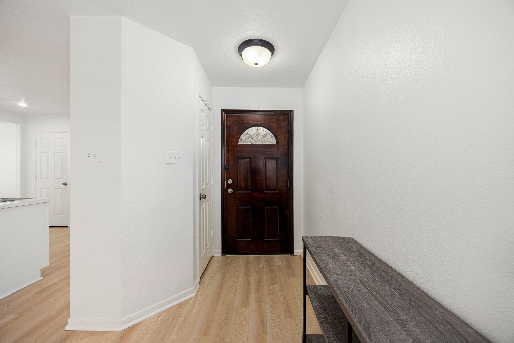 5038 Natchez Ridge Court Katy, TX 77449 - Photo 3 of 26 a view of a hallway view with wooden floor and staircase