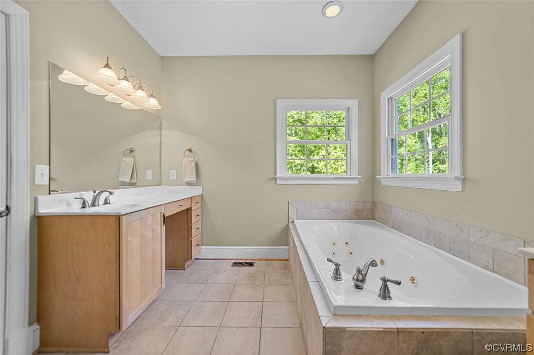 15163 Rice Road Beaverdam, VA 23015 - Photo 16 of 50 a bathroom with a bathtub and a sink