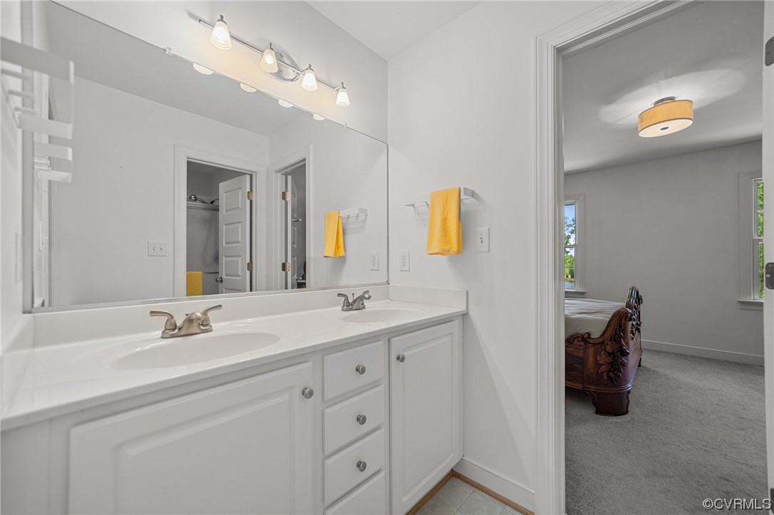 15163 Rice Road Beaverdam, VA 23015 - Photo 21 of 50 a bathroom with a sink double vanity and a mirror