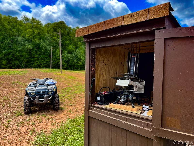 15163 Rice Road Beaverdam, VA 23015 - Photo 39 of 50 a house view with a sitting space fire pit and outdoor space