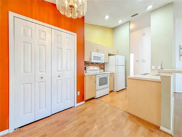 a view of a kitchen with a sink and dishwasher
