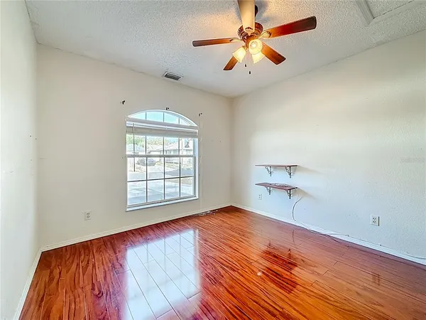 a view of an empty room with a window