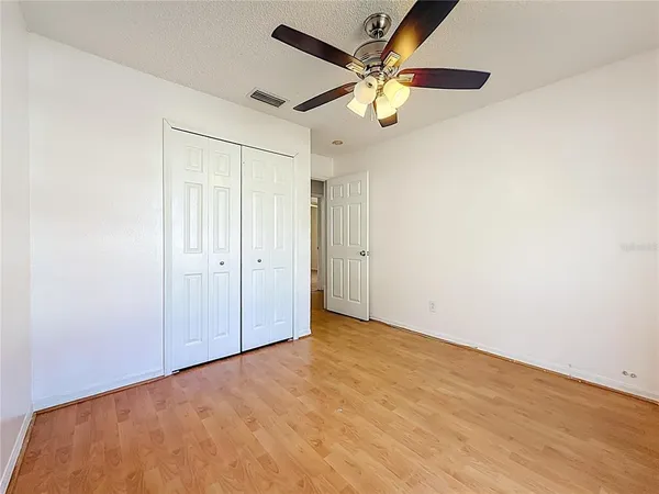 a view of livingroom with hardwood floor and ceiling fan