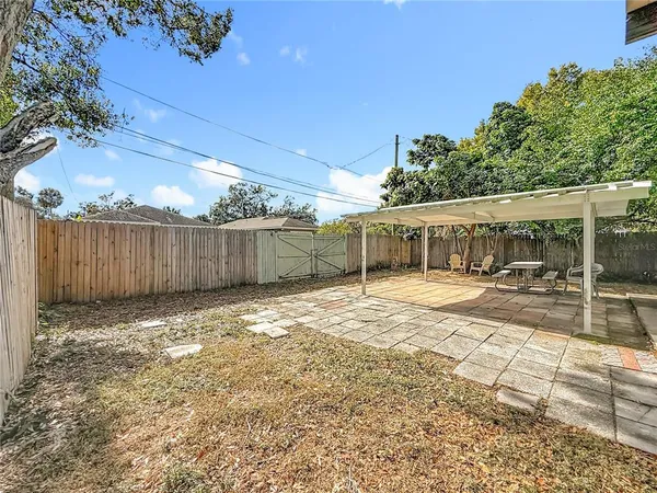 an aerial view of residential houses with yard