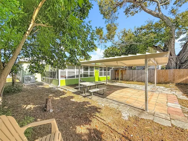 an aerial view of residential building with trees