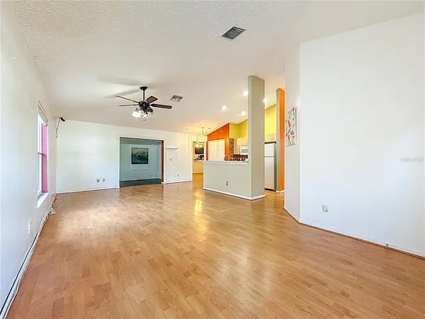 a view of n empty room with a window