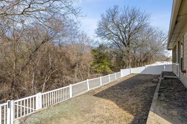 an empty room with a empty space and a window