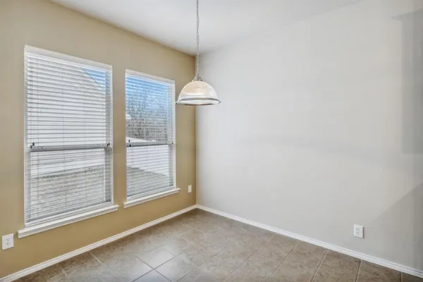 a kitchen with stainless steel appliances granite countertop wooden cabinets a stove top oven a sink and dishwasher