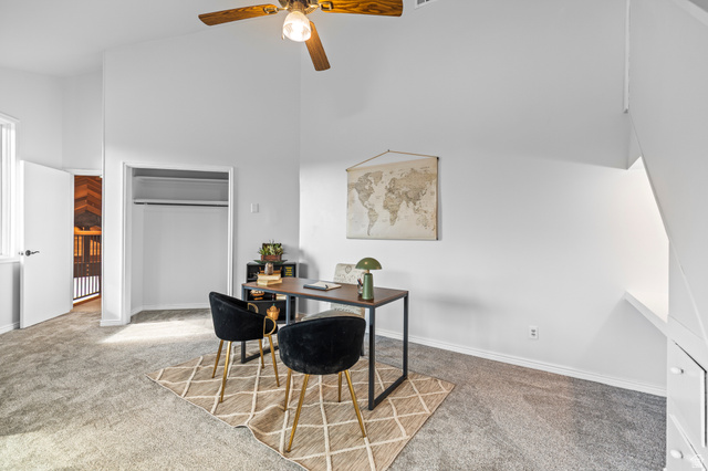 460 Omni Point Road Central Valley, UT 84754 - Photo 50 of 101 Spacious room featuring vaulted ceilings, light gray carpeting, and a ceiling fan