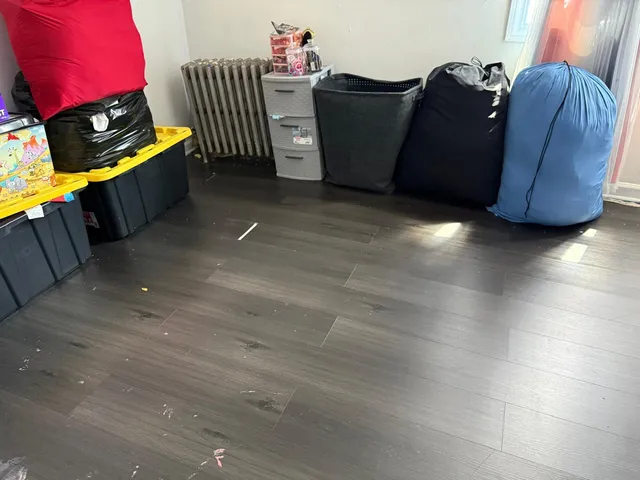 a bedroom with a bed and a mirror