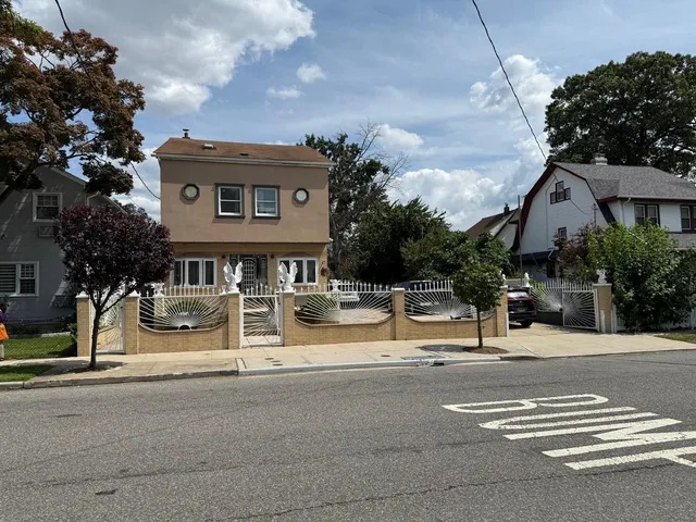 a front view of a house with barbeque