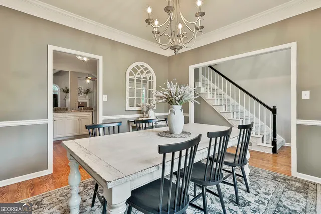 a kitchen with a refrigerator a microwave a stove and cabinets