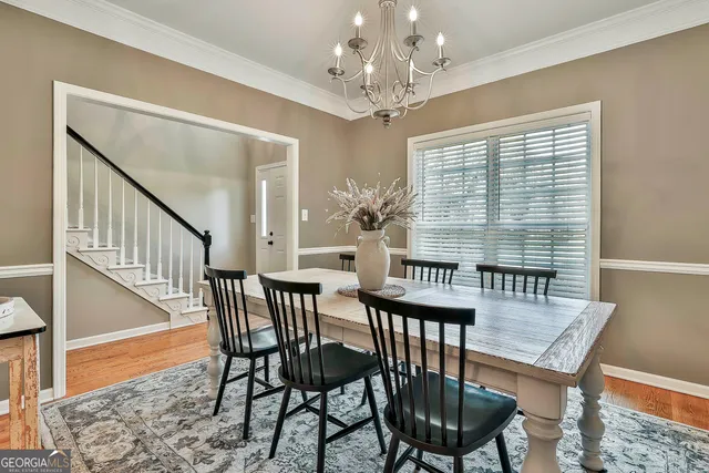 a kitchen with kitchen island a refrigerator stove microwave and cabinets