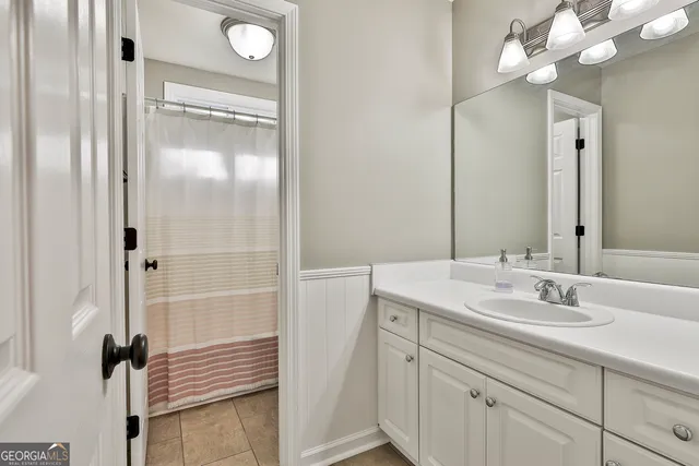 a living room with furniture and a walk in closet