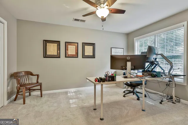 a view of a chairs and table in the patio