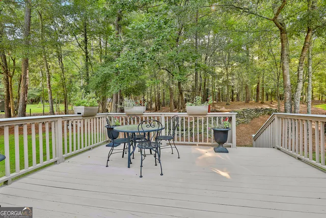 an aerial view of a house with outdoor space