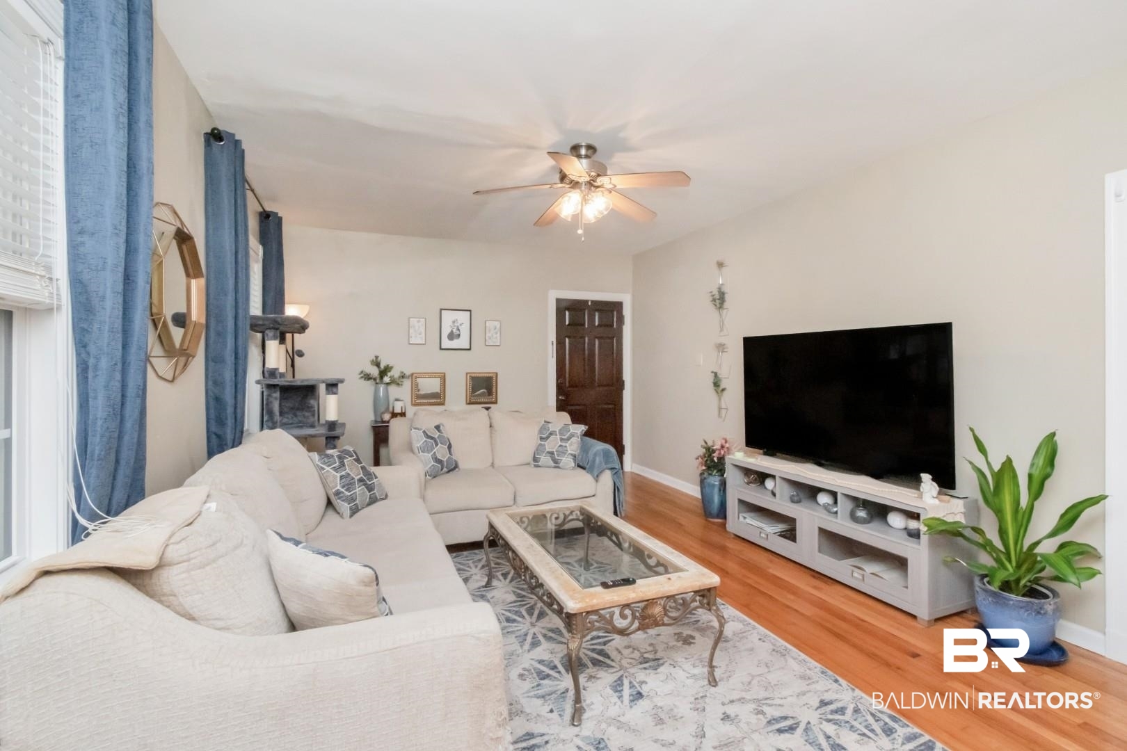 214 Upham Street, Unit 17C Mobile, AL 36607 - Photo 17 of 32 Living room with a ceiling fan and light wood finished floors