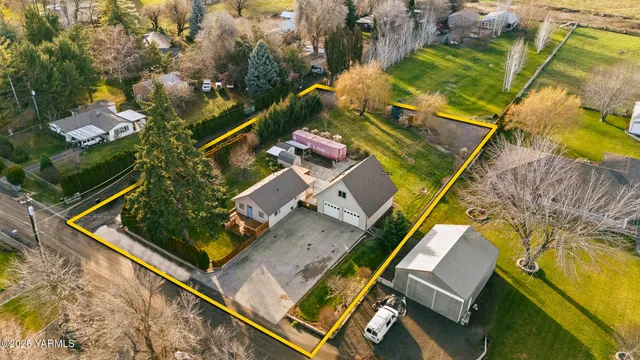 an aerial view of swimming pool with seating area