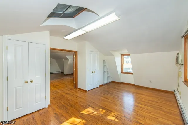 a kitchen with a refrigerator and a sink