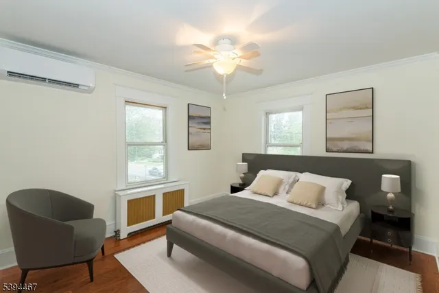 a bedroom with a bed and chandelier