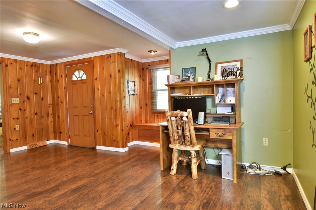 1711 Salt Springs Road Mineral Ridge, OH 44440 - Photo 4 of 35 Office area with wooden walls, ornamental molding, and dark hardwood flooring