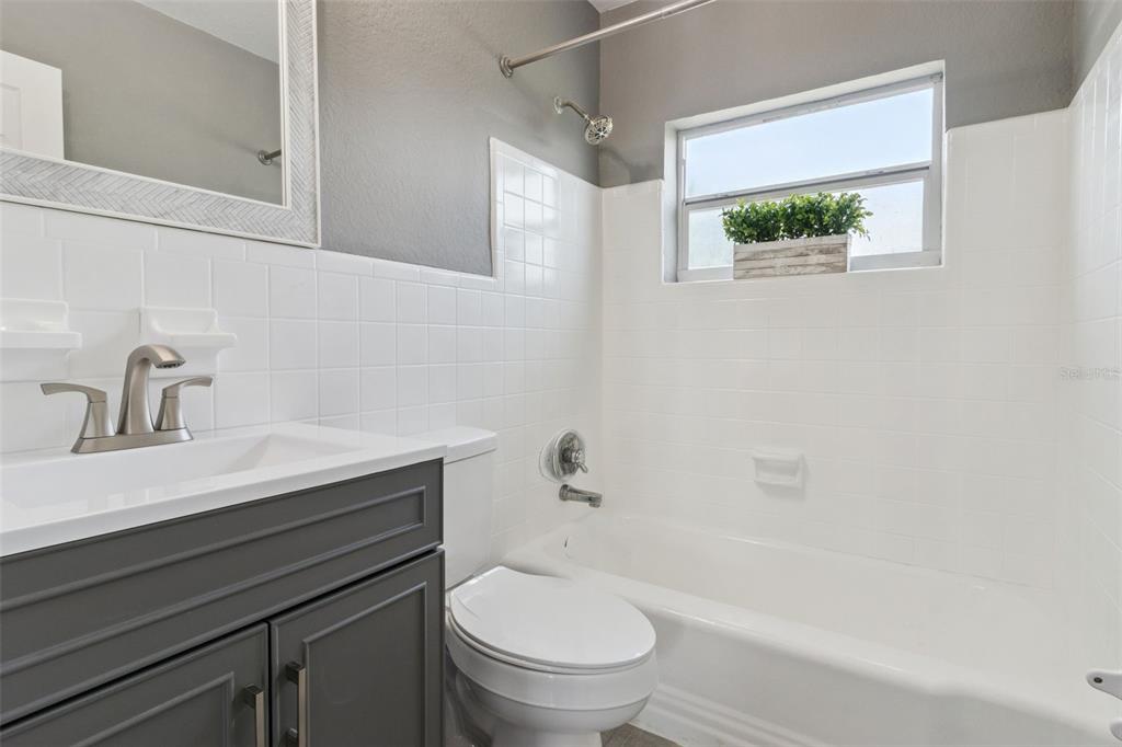 331 Walter Avenue Frostproof, FL 33843 - Photo 13 of 21 a bathroom with a sink a toilet and a bathtub