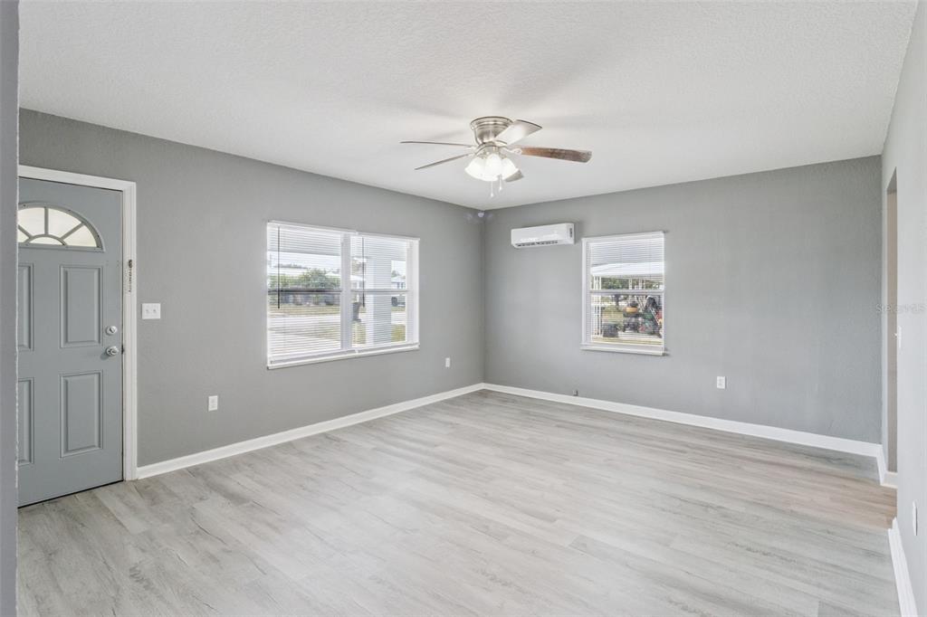 331 Walter Avenue Frostproof, FL 33843 - Photo 2 of 21 an empty room with windows and fan