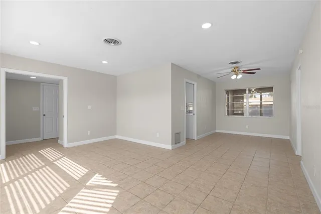 a view of an empty room with a window