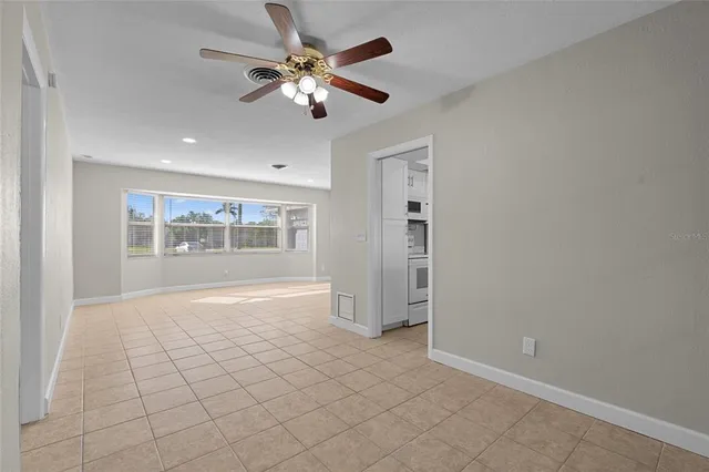 a view of an empty room with a window