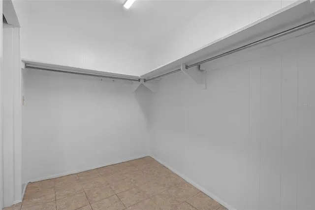 a view of a room with shelf on the wall