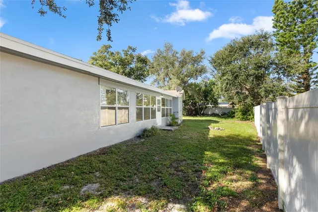 a view of backyard with a garden and plants