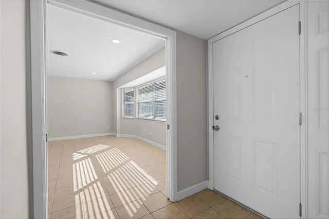 a view of an empty room and window