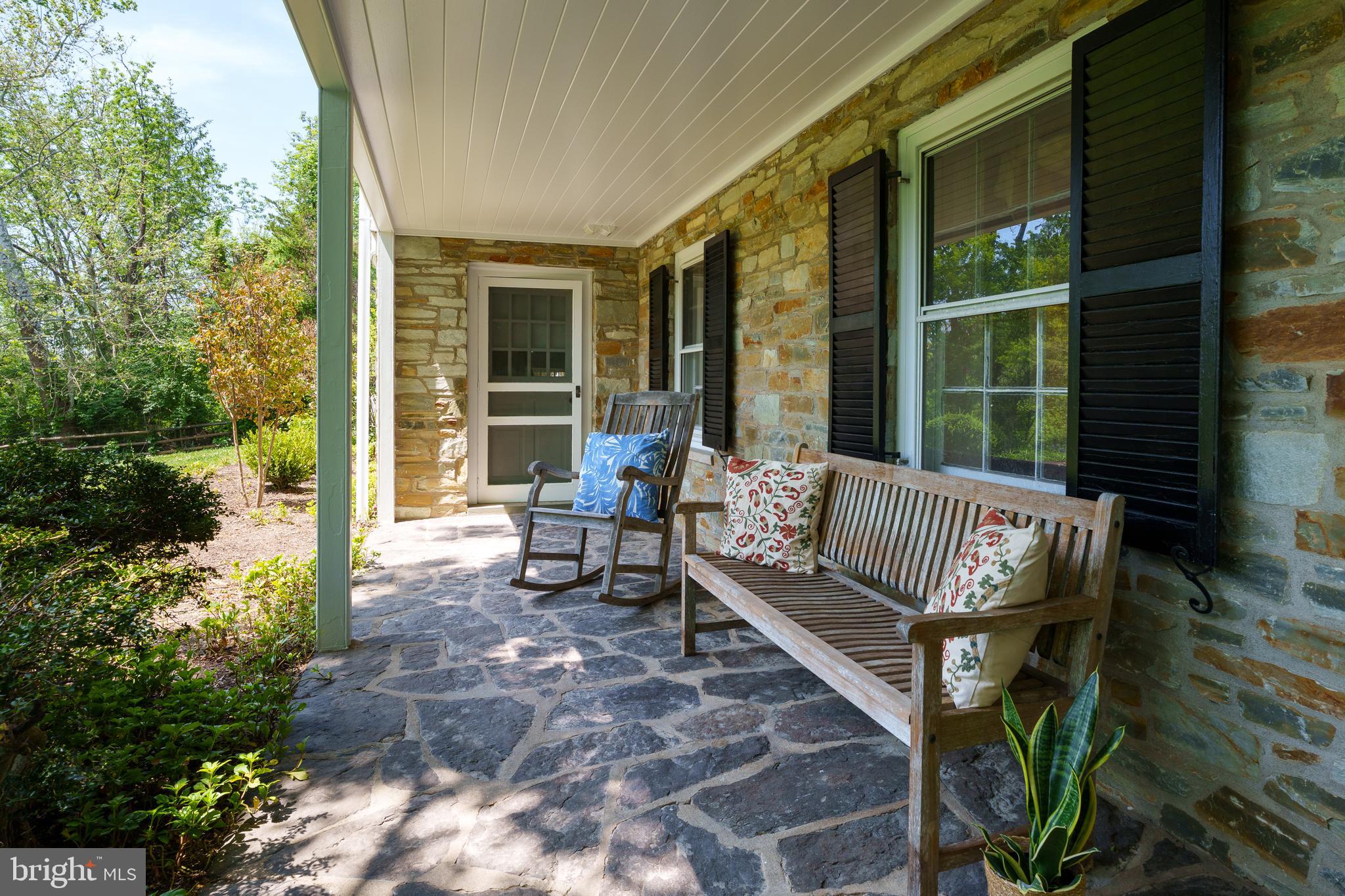 821 Pretty Brook Road Princeton, NJ 08540 - Photo 5 of 32 a view of a bench in the porch