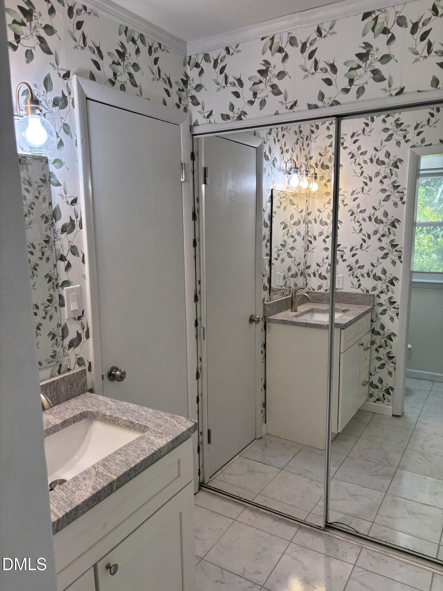 5612 Falls Of Neuse Road, Unit D Raleigh, NC 27609 - Photo 11 of 14 a bathroom with a granite countertop sink and a mirror