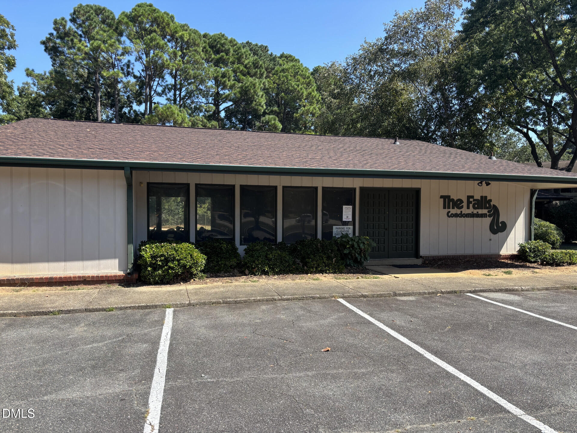 5612 Falls Of Neuse Road, Unit D Raleigh, NC 27609 - Photo 13 of 14 a front view of a house with a garden