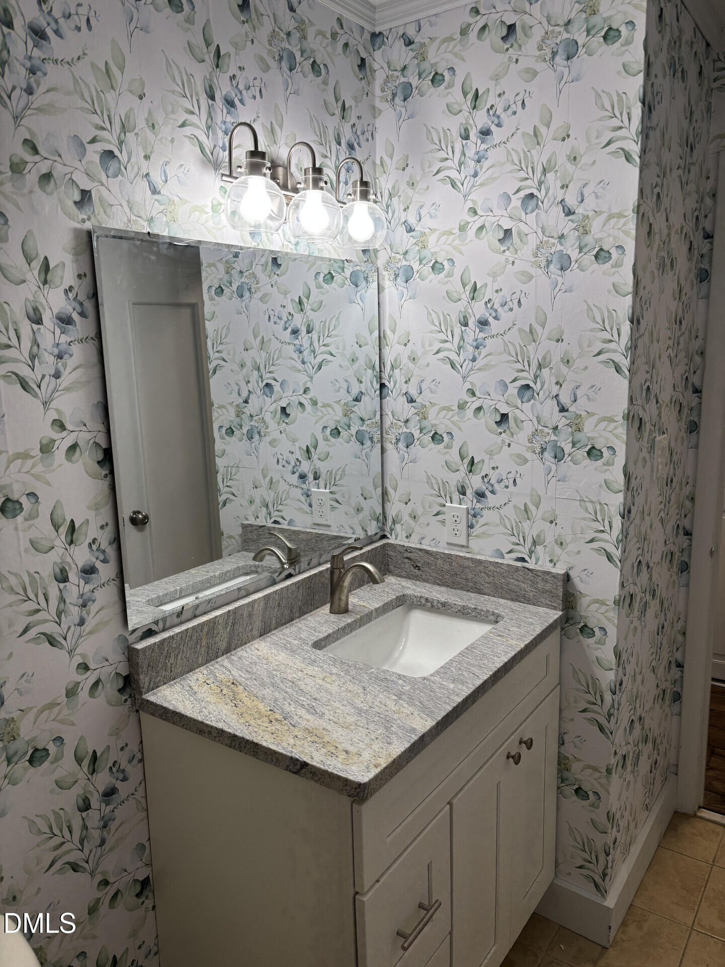 5612 Falls Of Neuse Road, Unit D Raleigh, NC 27609 - Photo 8 of 14 a bathroom with a granite countertop sink and a mirror