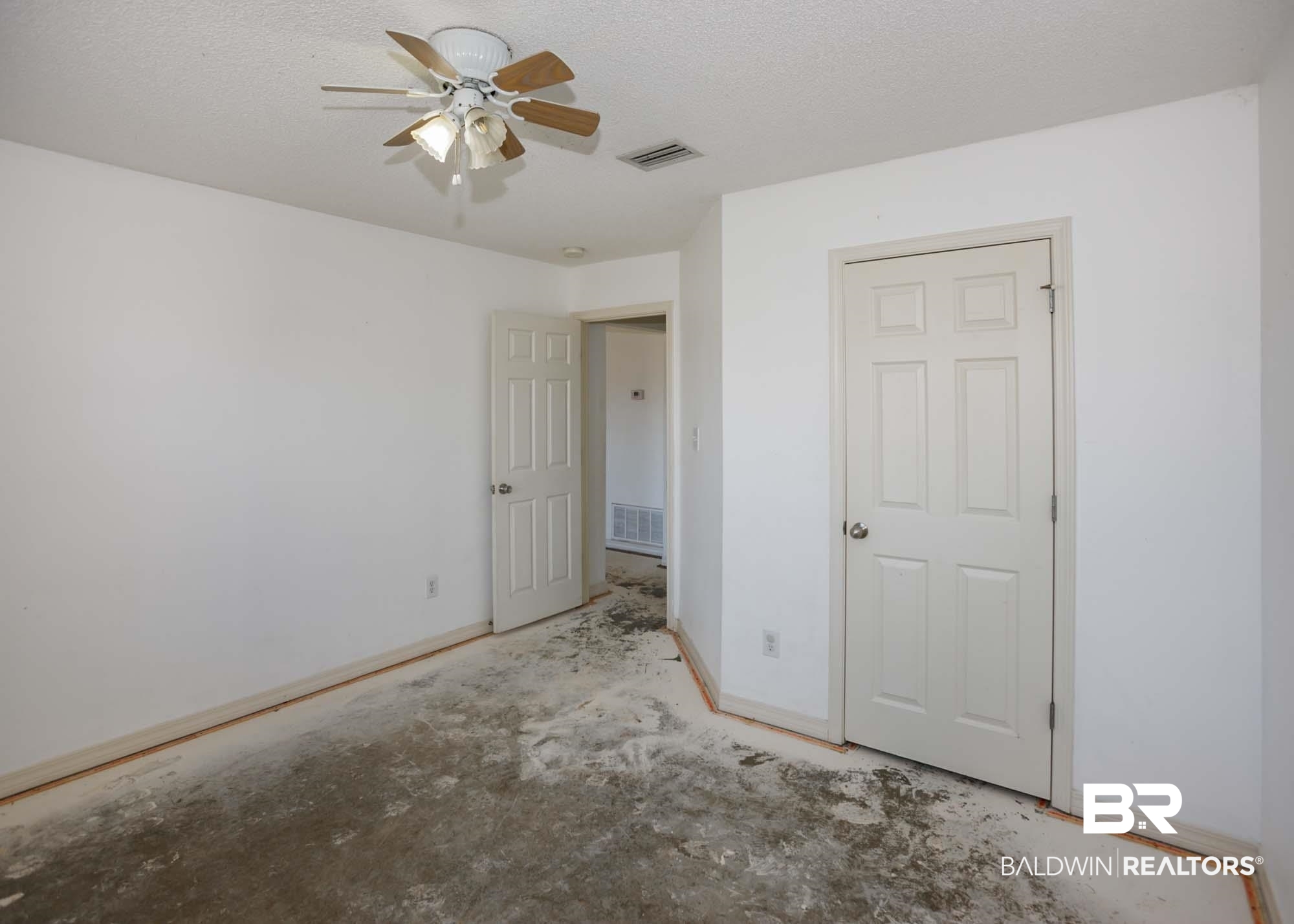 2530 Ashburn Lane Foley, AL 36535 - Photo 40 of 46 Unfurnished bedroom featuring ceiling fan and a textured ceiling