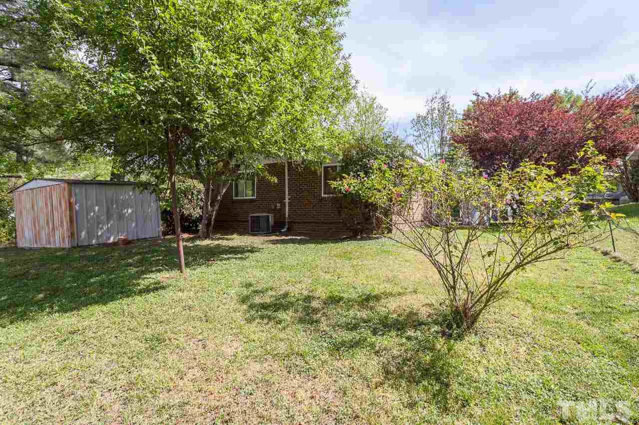 859 Hadley Road Raleigh, NC 27610 - Photo 12 of 17 As well as the side patio, the fenced yard has nice mature trees, and a good sized storage shed out back.