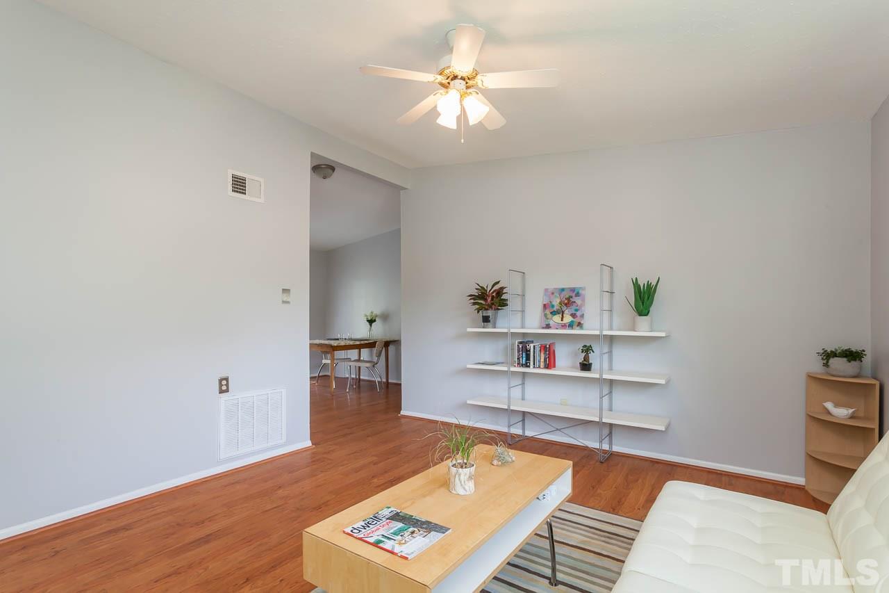 859 Hadley Road Raleigh, NC 27610 - Photo 16 of 17 The open floor plan lets the public spaces live together, but allows separate spaces for each