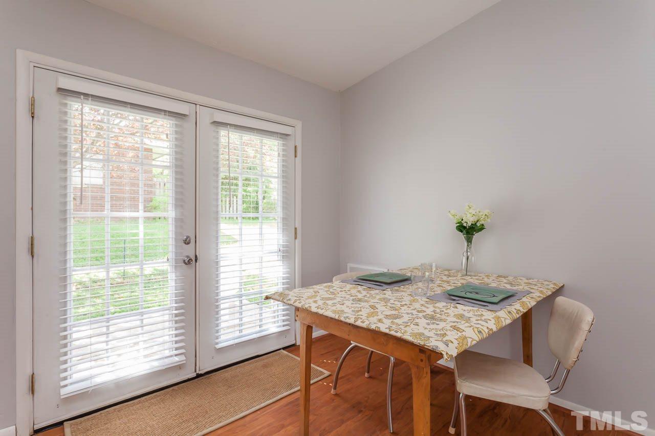 859 Hadley Road Raleigh, NC 27610 - Photo 3 of 17 The dining room has french doors out to a concrete patio.