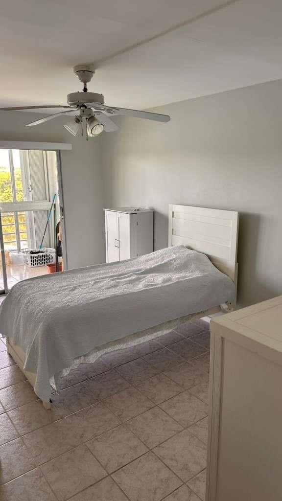4050 Ainslie Drive, Unit 4050 Boca Raton, FL 33434 - Photo 11 of 17 a bedroom with a bed and window