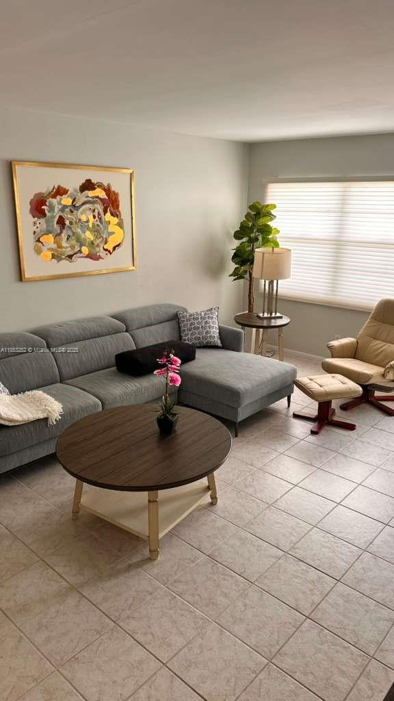 4050 Ainslie Drive, Unit 4050 Boca Raton, FL 33434 - Photo 4 of 17 a living room with furniture and next to a window