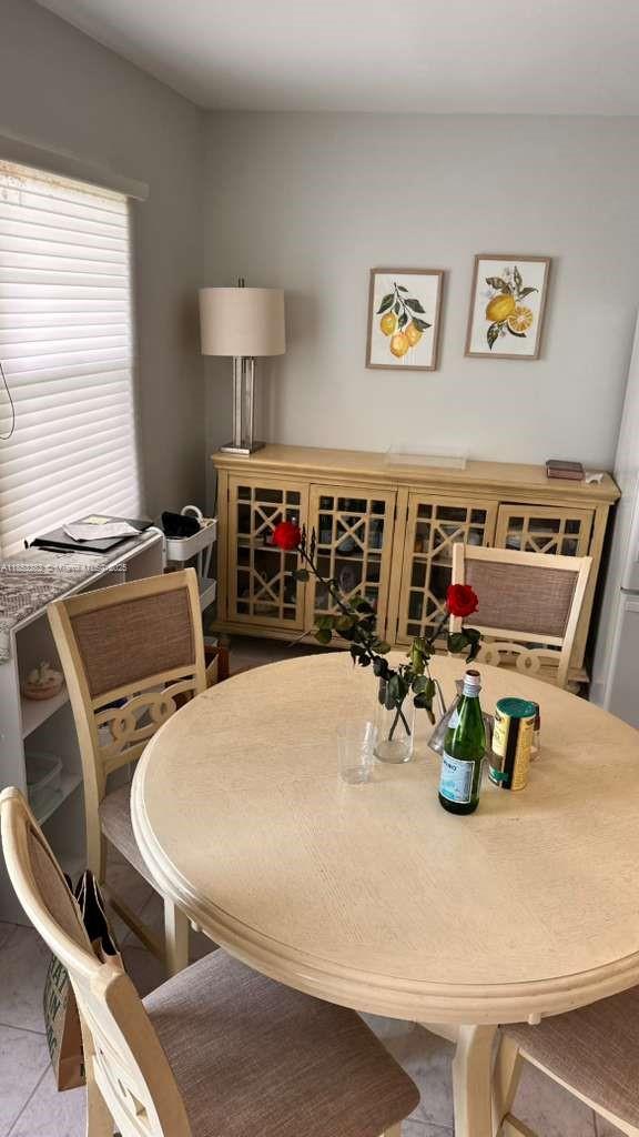4050 Ainslie Drive, Unit 4050 Boca Raton, FL 33434 - Photo 5 of 17 a view of a dining room with furniture