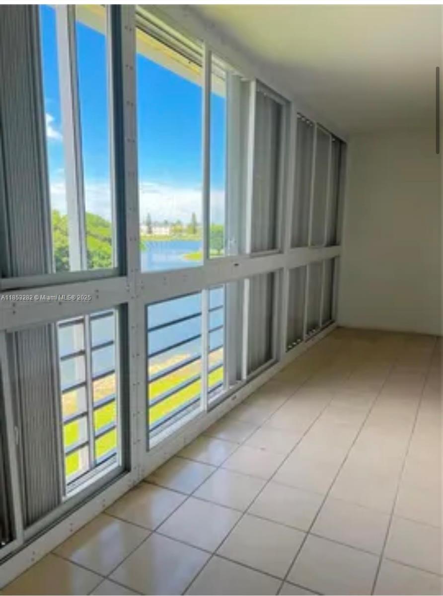 4050 Ainslie Drive, Unit 4050 Boca Raton, FL 33434 - Photo 7 of 17 a view of an empty room with window