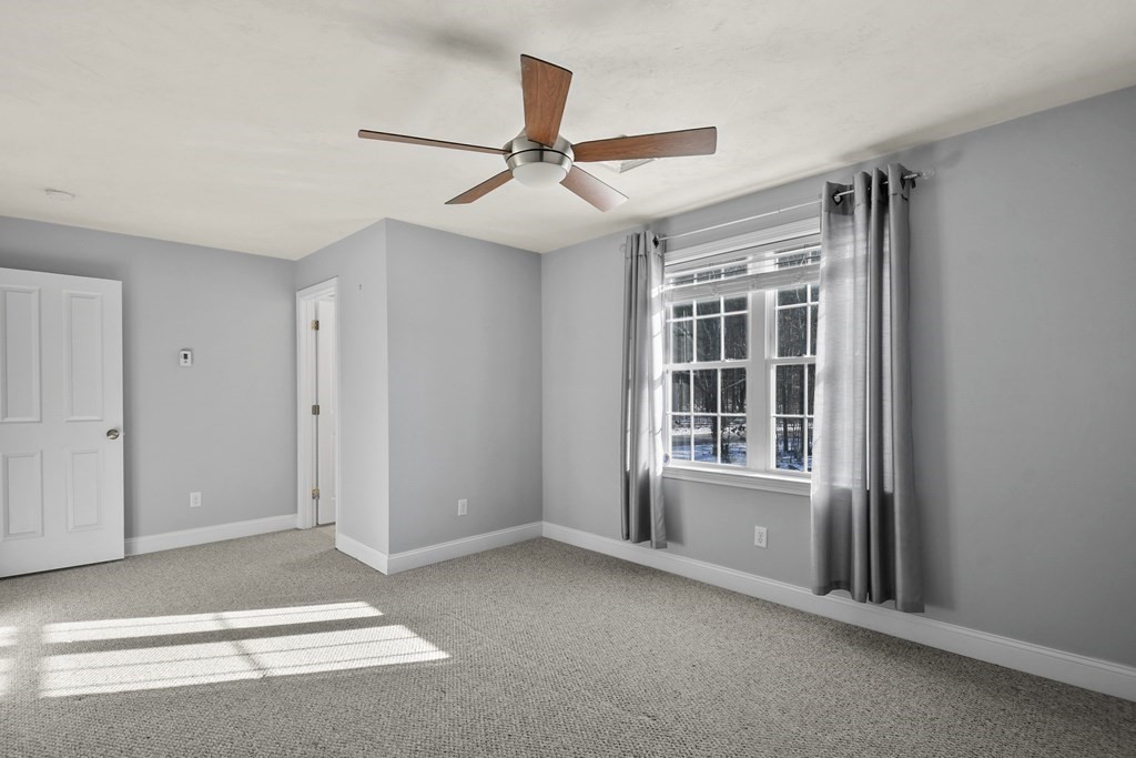 211 Barre Paxton Road, Unit 2 Rutland, MA 01543 - Photo 14 of 30 a view of an empty room with a window