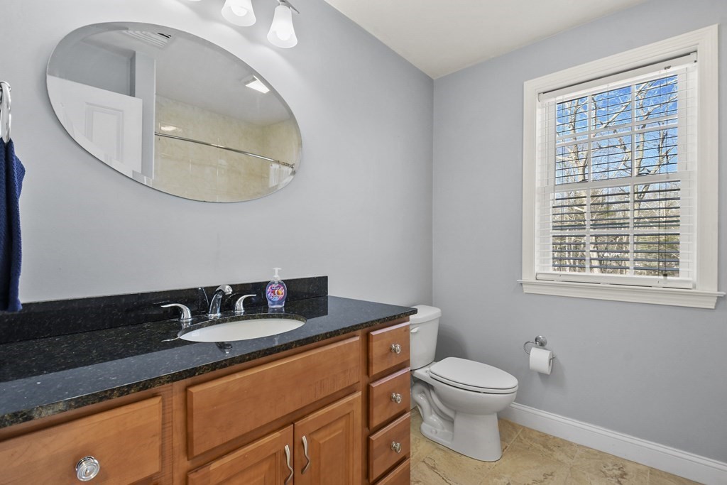 211 Barre Paxton Road, Unit 2 Rutland, MA 01543 - Photo 22 of 30 a bathroom with a toilet a sink and mirror