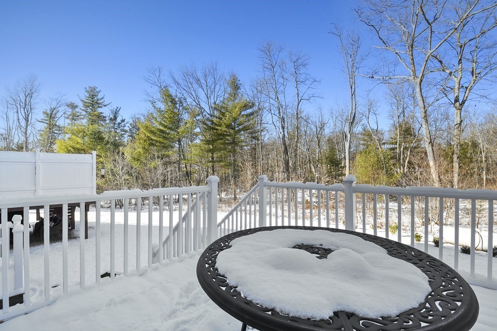 211 Barre Paxton Road, Unit 2 Rutland, MA 01543 - Photo 28 of 30 a backyard of a house with table and chairs