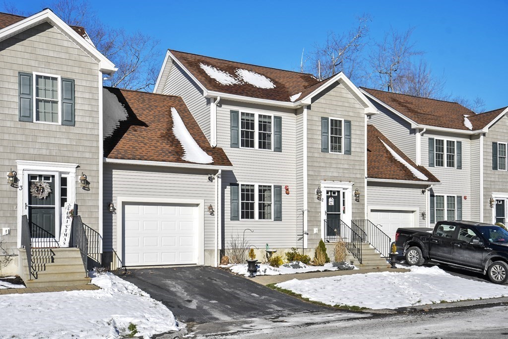 211 Barre Paxton Road, Unit 2 Rutland, MA 01543 - Photo 3 of 30 a front view of a house with a yard
