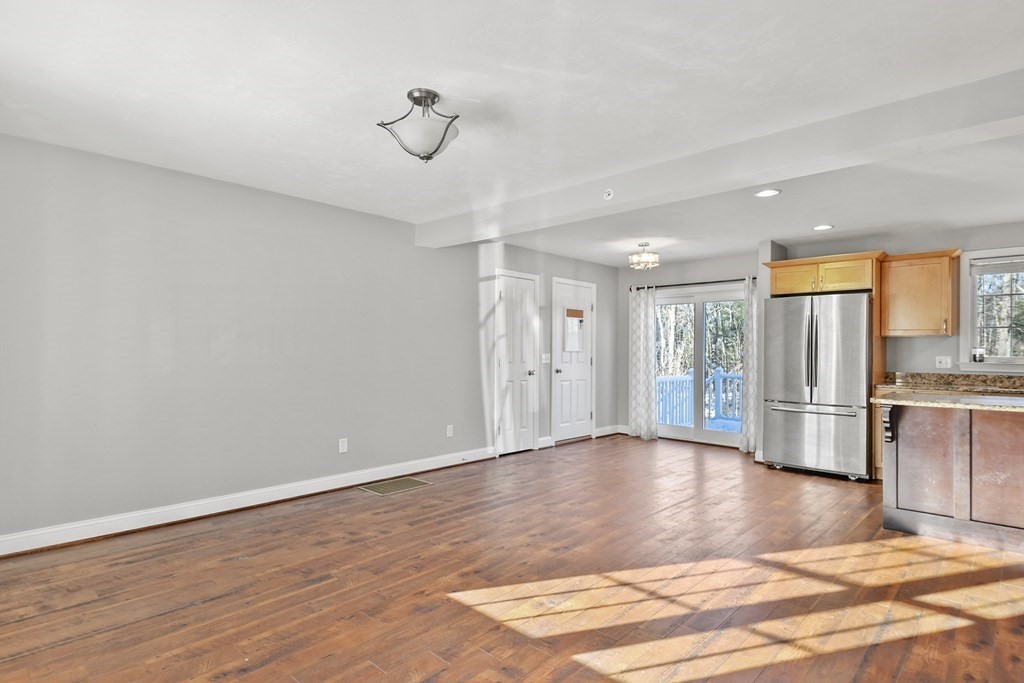 211 Barre Paxton Road, Unit 2 Rutland, MA 01543 - Photo 5 of 30 a view of a livingroom with wooden floor
