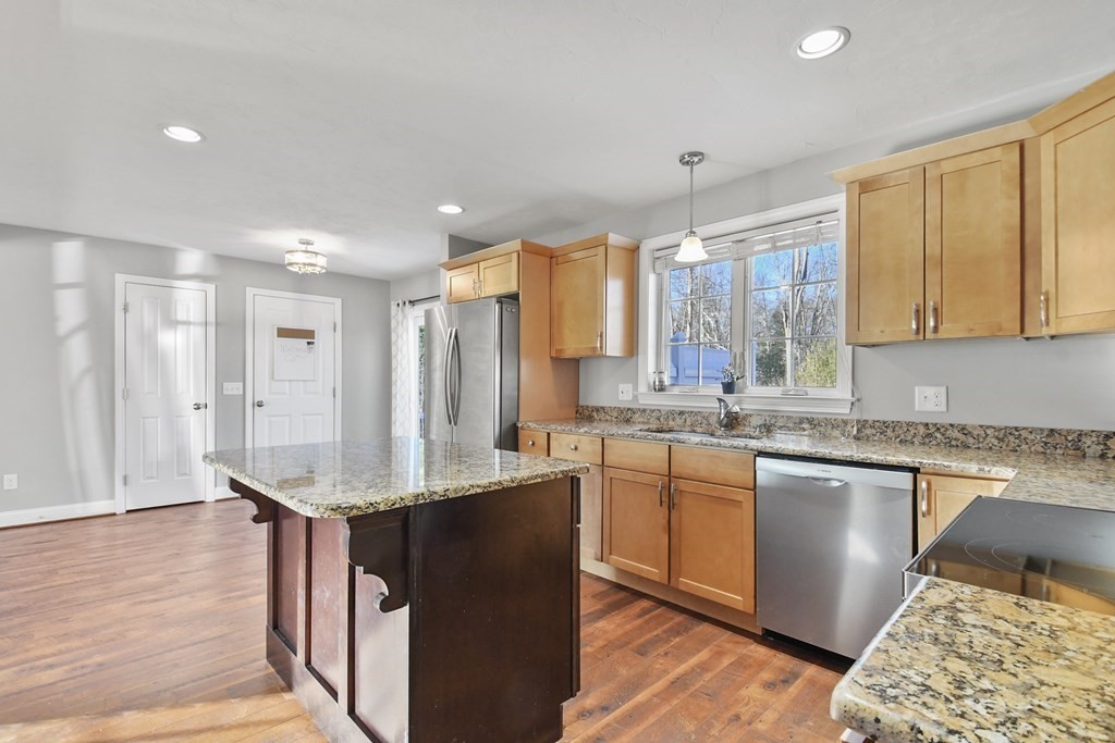 211 Barre Paxton Road, Unit 2 Rutland, MA 01543 - Photo 10 of 30 a kitchen with stainless steel appliances granite countertop a sink stove and refrigerator